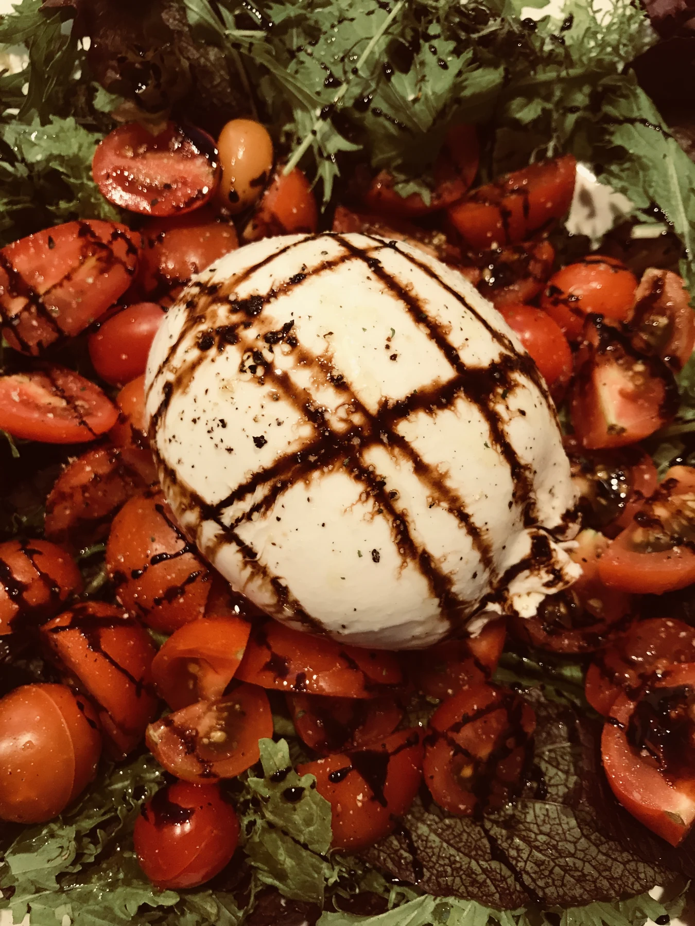 Tomatoes and cheese with a balsamic drizzle