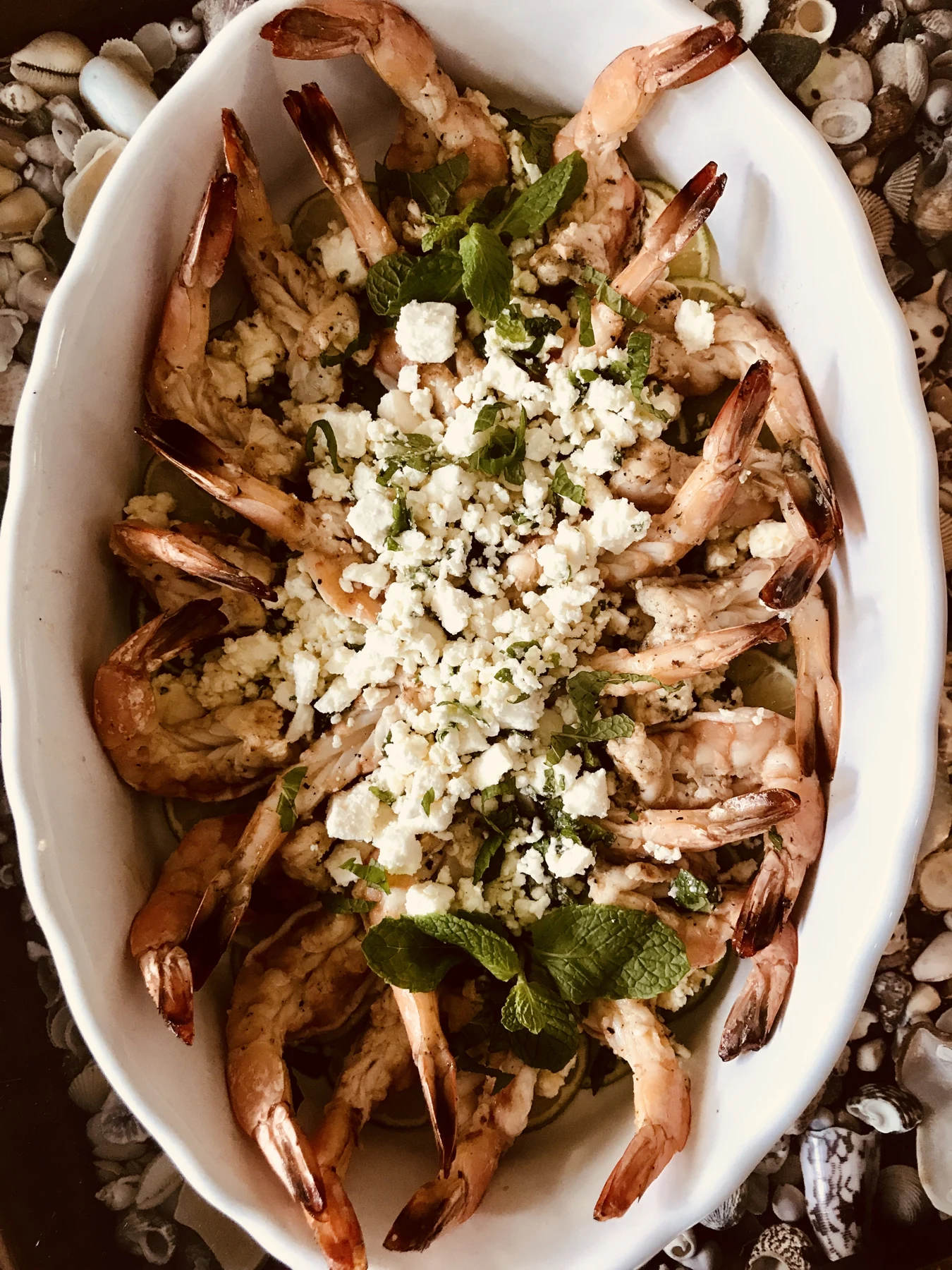 A generous platter of prawns, greens, and crumbled cheese from Jenn Marr’s gallery